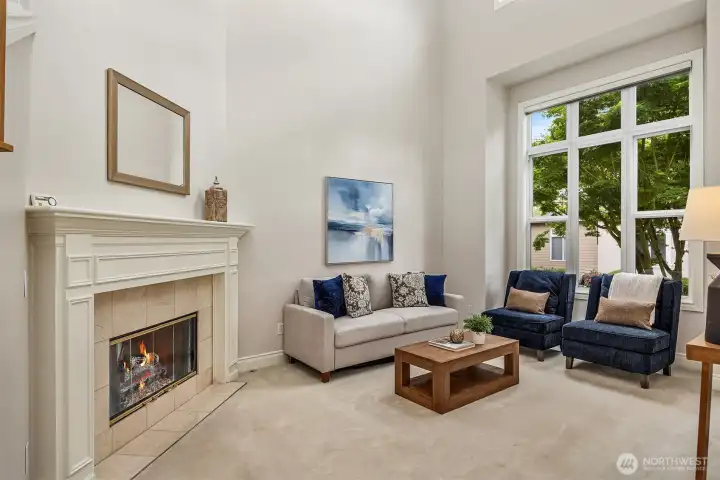Elegant formal living room to the right of the entry features a cozy gas fireplace. Elegant formal living room to the right of the entry features a cozy gas fireplace.