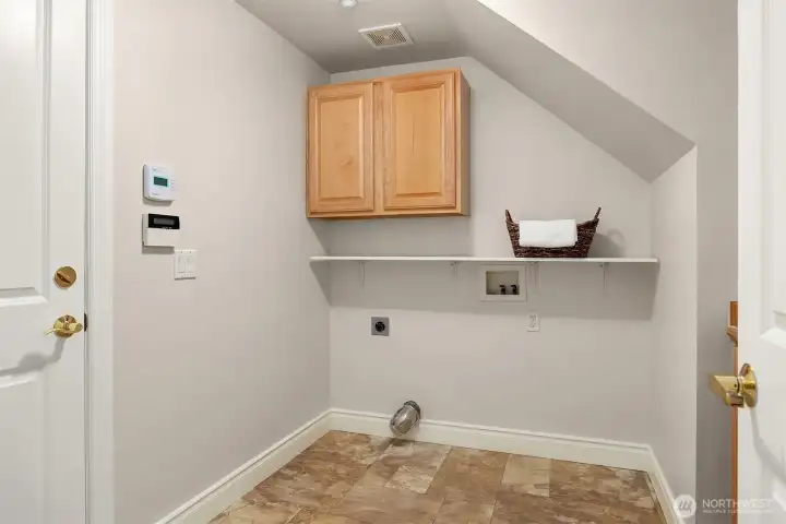 Downstairs laundry room with plenty of storage. Downstairs laundry room with plenty of storage.