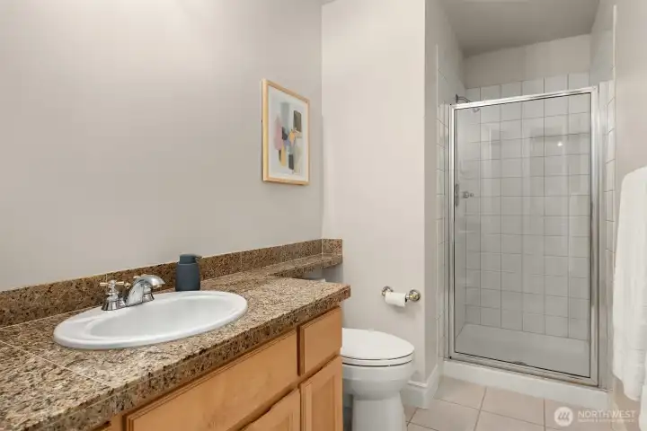 Main floor 3/4 bathroom, conveniently located down the hall from the living room. Main floor 3/4 bathroom, conveniently located down the hall from the living room.
