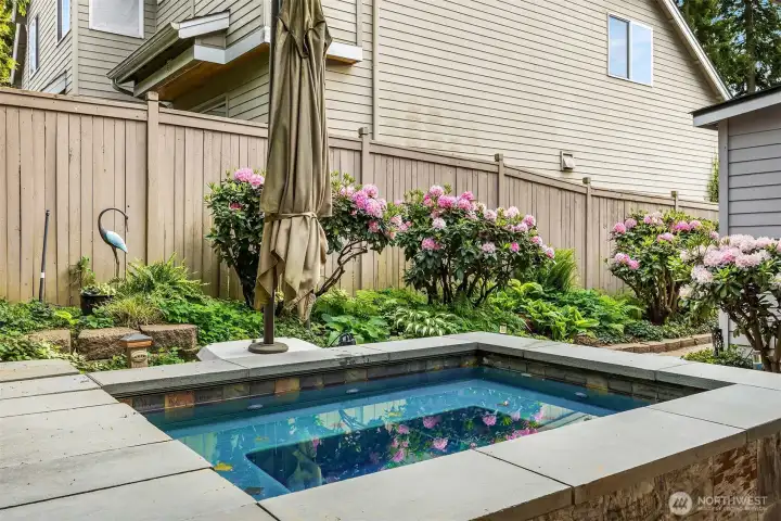 In-ground hot tub provides a spa-like escape at home. In-ground hot tub provides a spa-like escape at home.