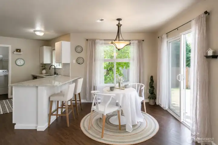 Lovely kitchen nook, leads out to the patio and level fenced yard.