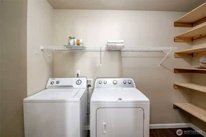 Laundry room leads to your two car garage. Tons of shelving for shoes, storage and of course all things laundry!