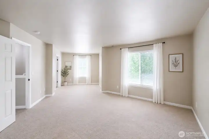Huge primary suite with ensuite bathroom and walk-in closet.