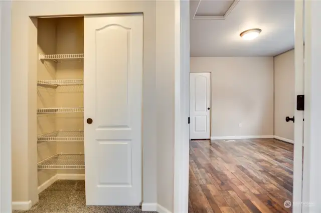 Linen closet in the hall and another angle of the South facing bedroom.