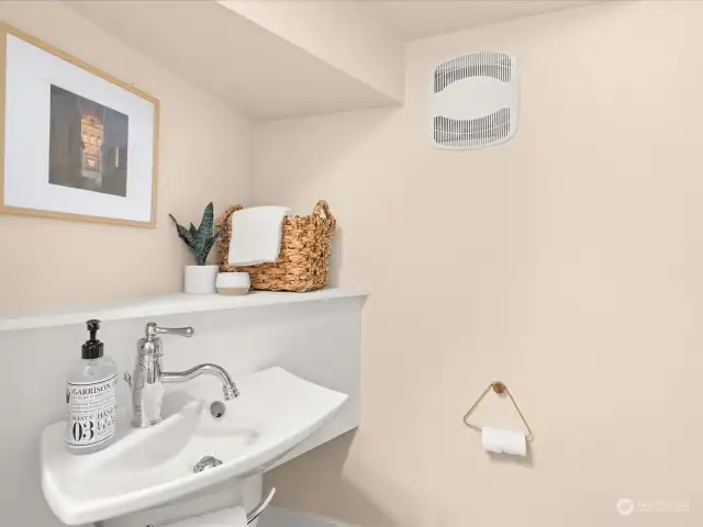 Main level powder room under the stairs.