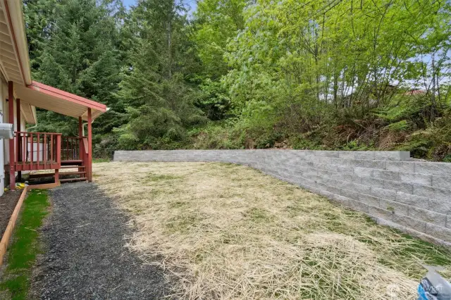 Brand new retaining wall, lawn and walkway
