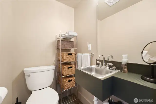 Primary bedroom’s half bath.
