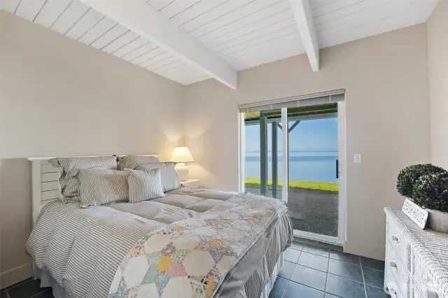 Potential bedroom #2 has access to the covered patio and beach.