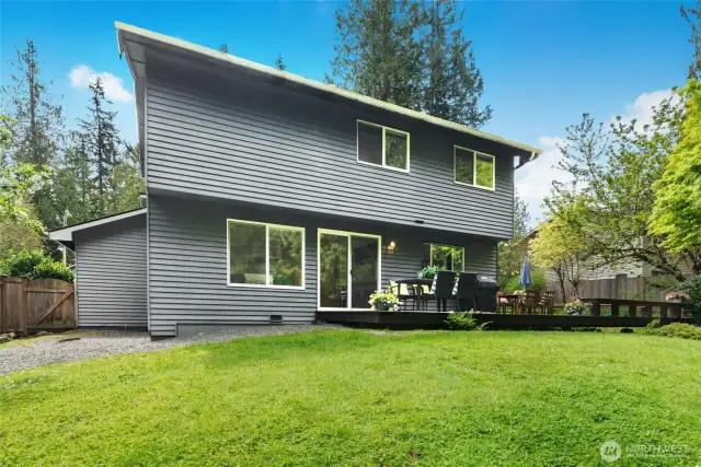 Lush, lawn area with stunning plantings.