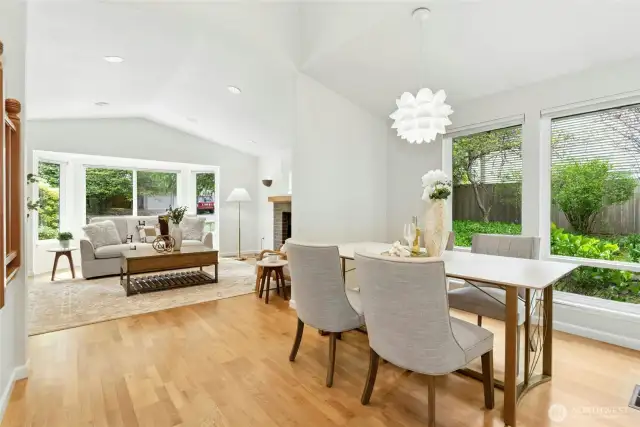 Angle looking towards the living room. Note the tall, contemporary ceilings and gleaming hardwoods on the main level.