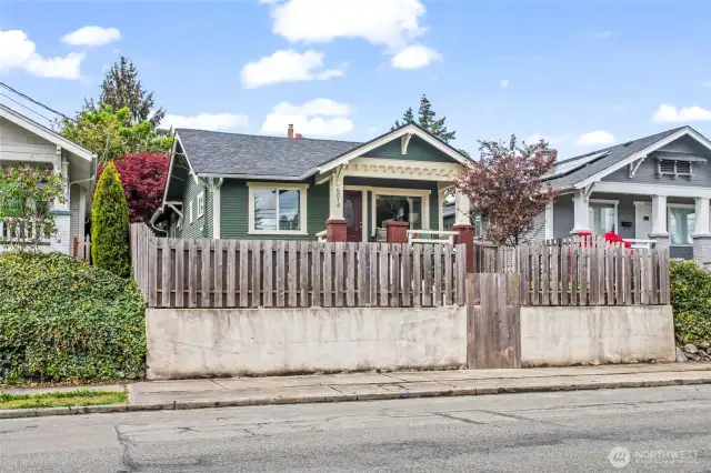 View from across the street - fully fenced with tall privacy fencing in the front yard.