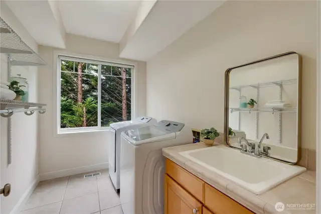 spacious and light filled laundry room on main floor