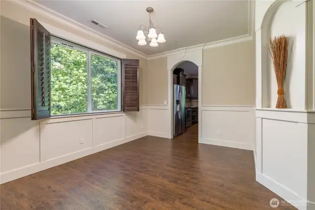 Dining room has beautiful arched wall niches