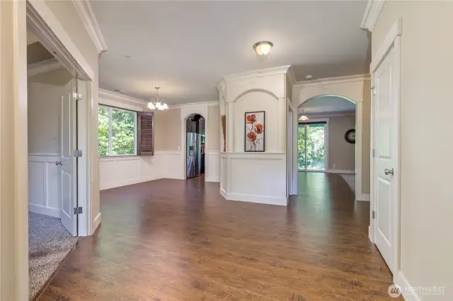 Entry hall with office to the left, dining/kitchen/living areas straight ahead.
