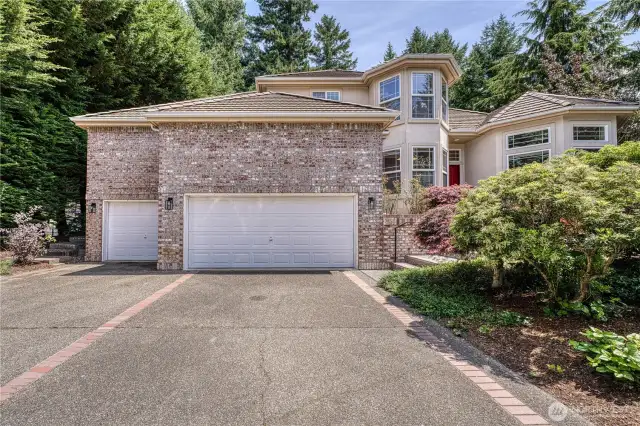 Beautiful brick and stucco home with expansive driveway and 3 car garage.