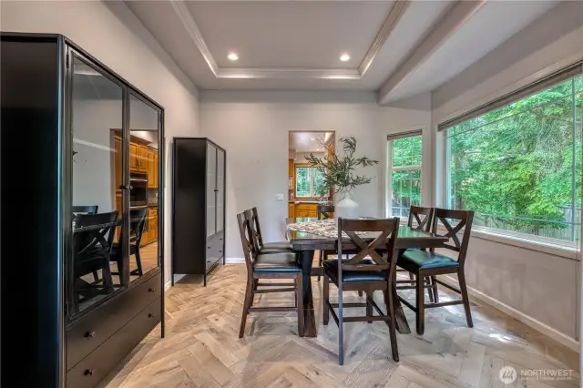 Another view of formal dining room and its charming floor leading into kitchen.