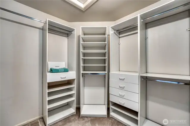 Primary walk-in closet with custom built-ins.