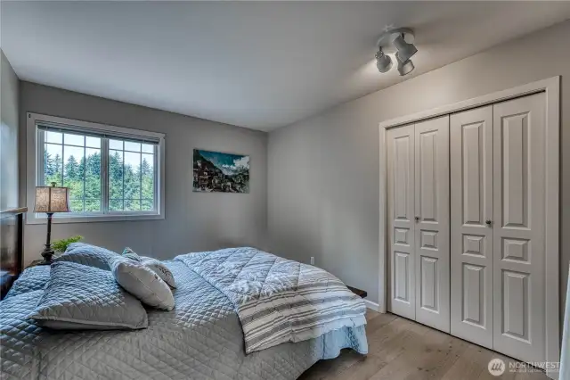 Bedroom #3 with hardwood flooring.