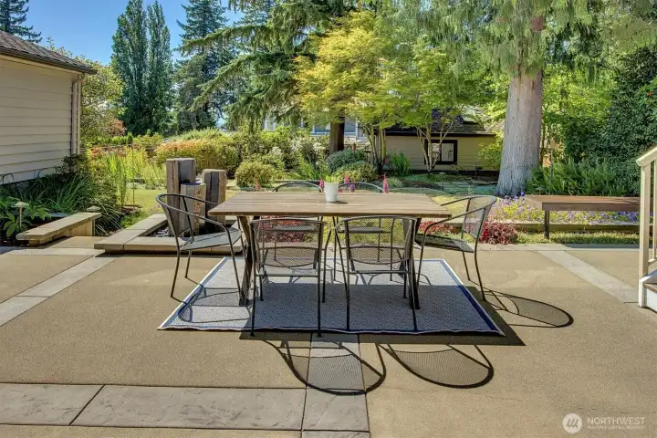 patio next to professionall landscaped backyard