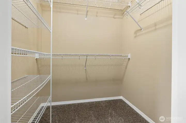 Primary bedroom walk-in closet.