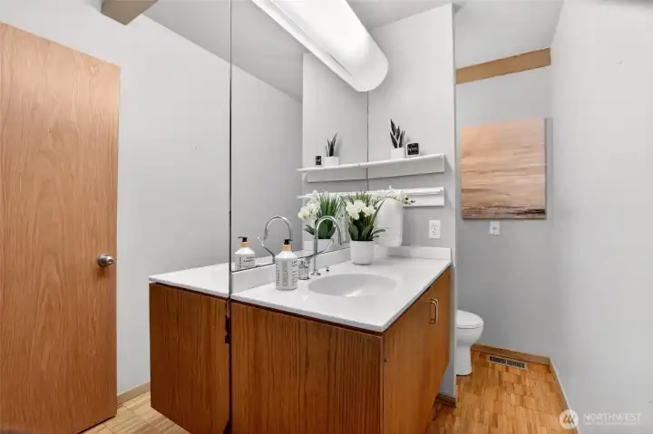 Main level powder room with original mid-century modern cabinetry