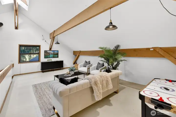 Formerly an architect's loft studio, upstairs, the loft and multipurpose room for games, an office, recreation or hobbies