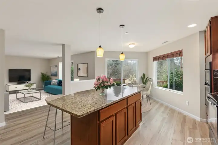 Large Kitchen with spacious island & dining area opens to large family room *virtully staged*