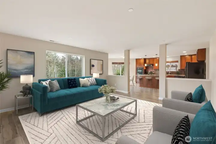 Large family room opens to kitchen and dining area *virtually staged*