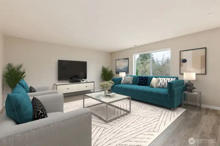 Large family room opens to kitchen and dining area *virtually staged*