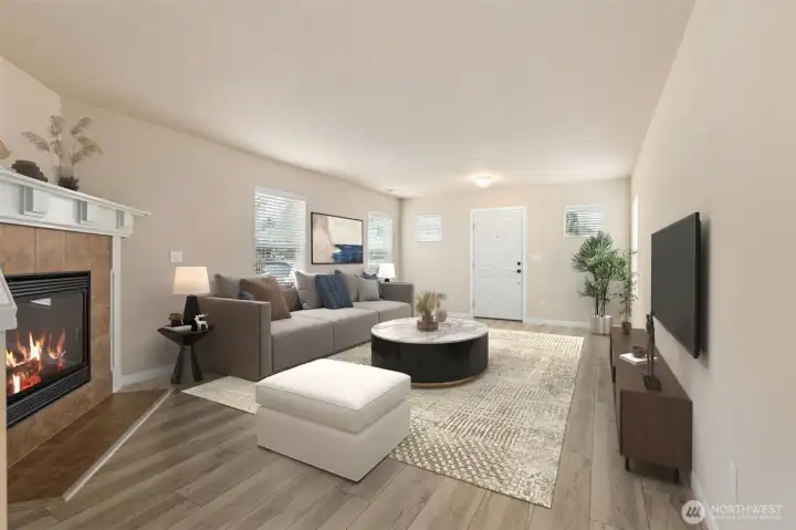Entry living room with gas fireplace *virtually staged*
