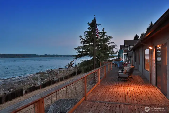 The deck runs the full length of the home.