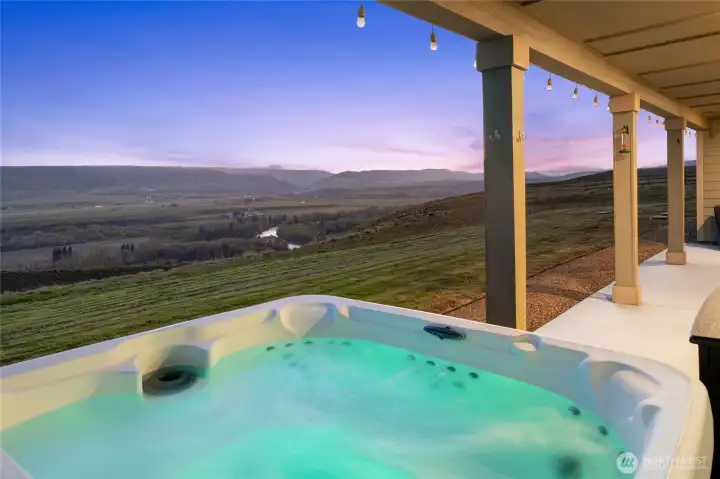 Relax and enjoy the view from the inviting hot tub.