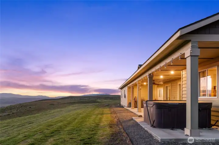 Spacious covered patio with warm lighting.