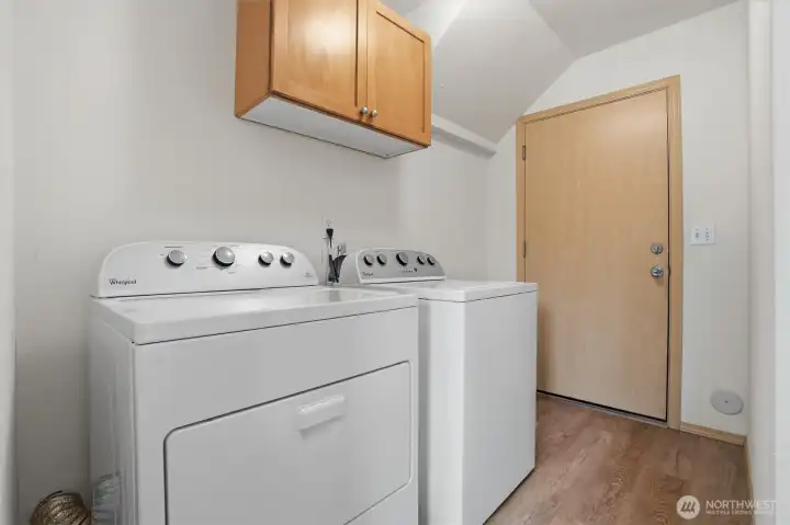 Washer and Dryer Downstairs.  Door leads to 2 car Garage.  Behind us the access to the downstairs backyard patio.