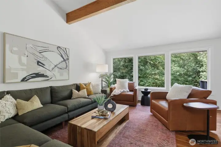 Living room has big windows.