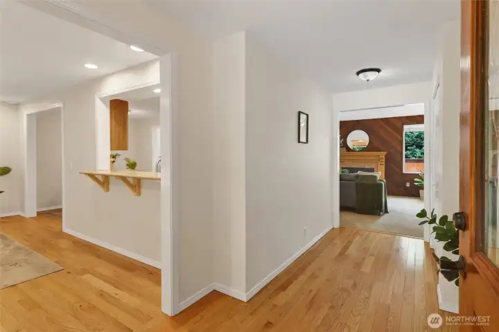 View upon entering with den and kitchen to the left and hallway to living room straight ahead.