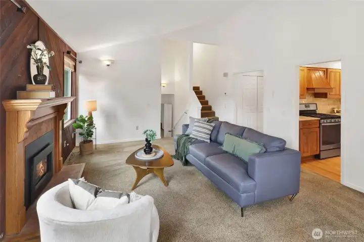 Main floor living room complete with gas fireplace and access to backyard deck.