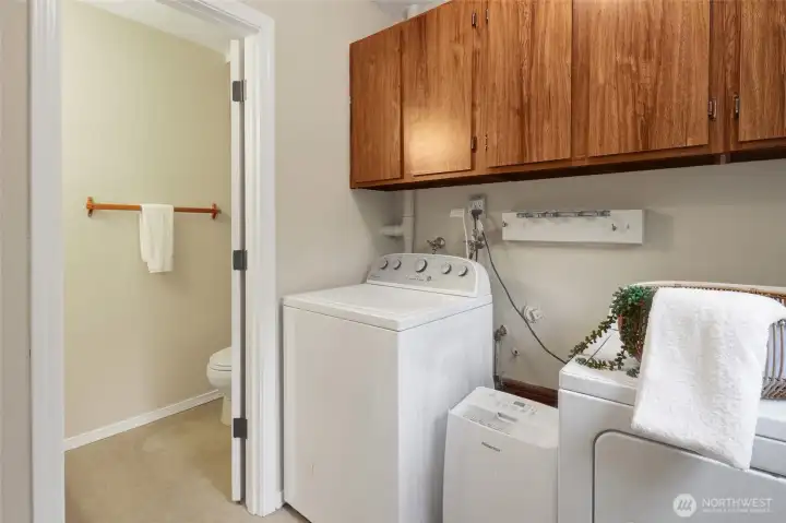 Laundry room on lower level and 1/2 bathroom.