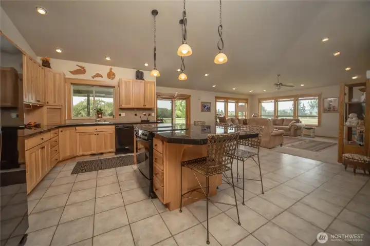 Expansive great room features vaulted ceilings.