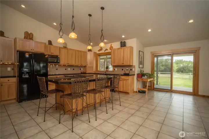 The kitchen is at the heart of the home and opens out to the covered back deck