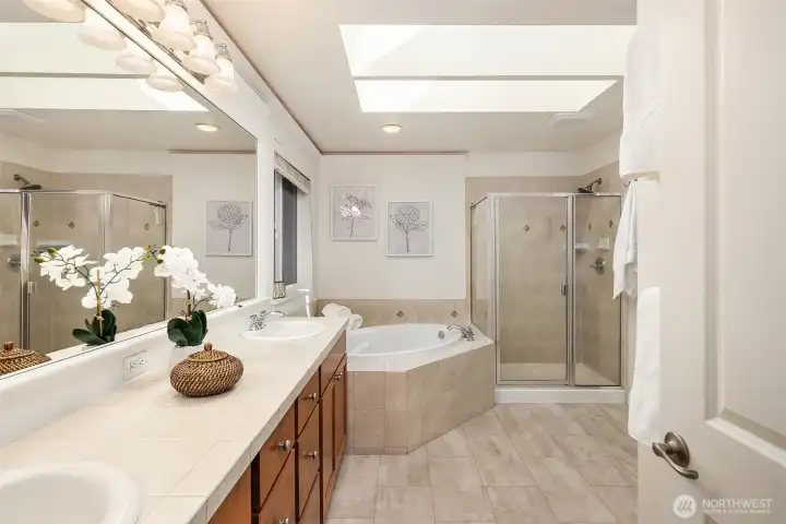 Primary bathroom has been updated with luxury vinyl plank flooring. Not shown is a large walk in closet for the primary suite.