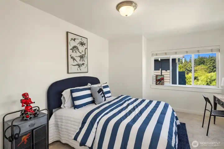 The third bedroom upstairs - all rooms are a nice size, big enough for queen beds and with great natural light.