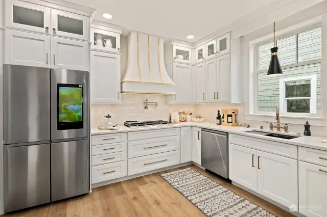 Stunning remodel in this Chef's kitchen. High end appliances and designer lighting.