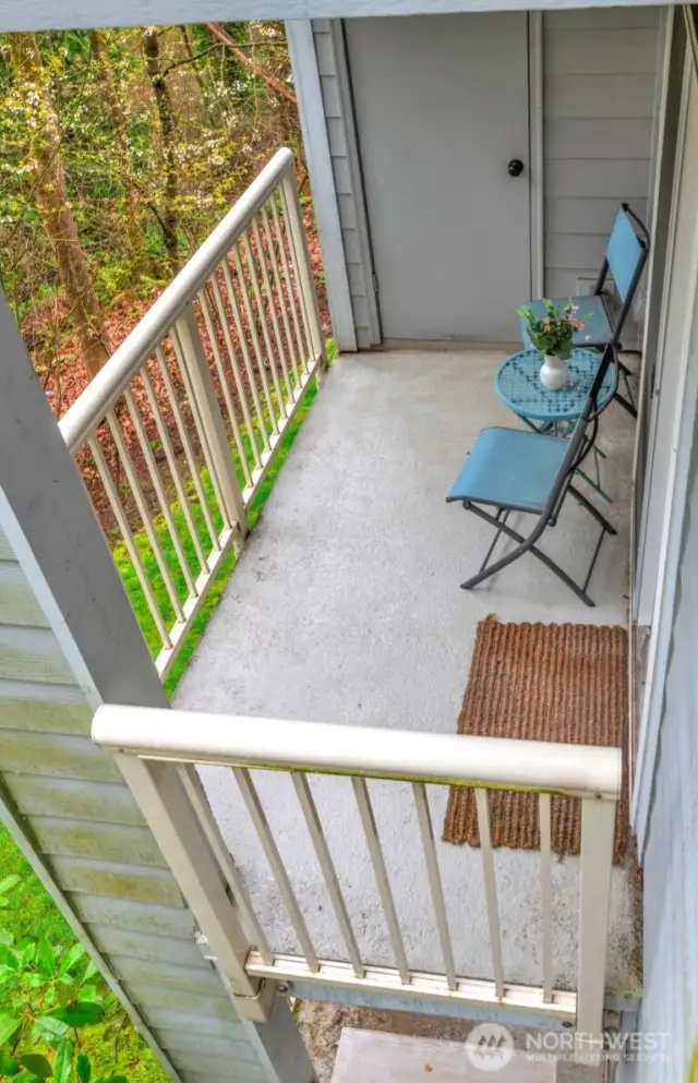 Enjoy your morning coffee and enjoy the privacy and nature of the adjacent greenbelt on your own private deck. The door shown is an additional storage closet.