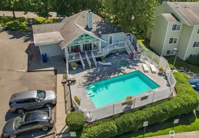Here is a drone photo of the swimming pool, hot tub, and community clubhouse in the summer. Renton Ridge has great amenities!