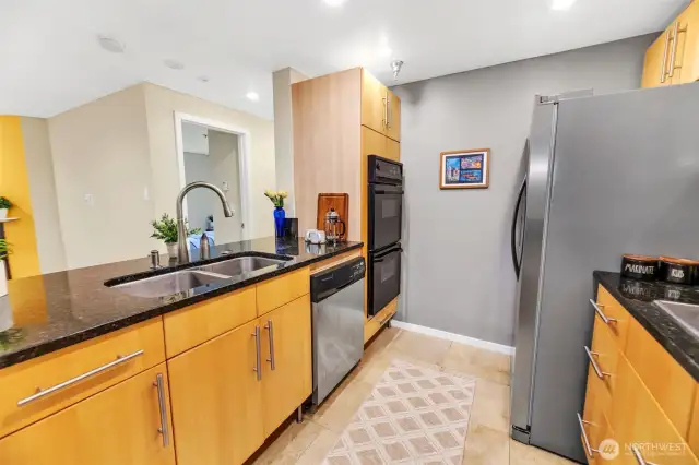 The kitchen also features open concept living, stainless undermount double sink, stainless dishwasher, double oven, and a robust garbage disposal (not shown).