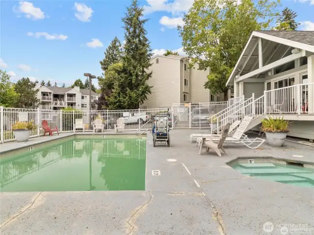 Another photo showing the pool and hot tub open during summertime.