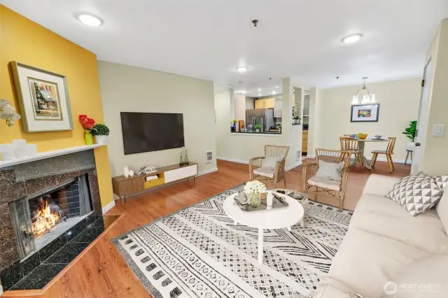 This view is from the corner near the patio door back towards the fireplace. This wood burning fireplace and room are virtually staged.