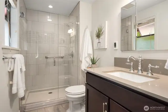Updated primary en suite bathroom on upper level