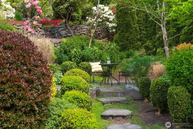 Extensive mature landscaping provides serene setting